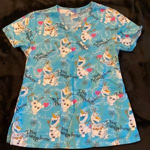 A Disney winter scrub top